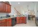 Open concept kitchen with granite countertops and dark wood cabinets at 206 Mossy Stone Ct. # 1605, Murrells Inlet, SC 29576