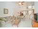 View of the living room shows open floor plan to the kitchen and upstairs loft at 206 Mossy Stone Ct. # 1605, Murrells Inlet, SC 29576