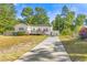 Charming single story home with a spacious front yard and driveway at 1412 Hemingway St., Myrtle Beach, SC 29577