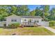 Charming white house with a deck and well-manicured lawn at 1412 Hemingway St., Myrtle Beach, SC 29577