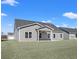 House exterior with gray siding and covered patio at 315 Hayloft Circle, Conway, SC 29526