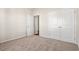 Spacious bedroom with neutral walls, carpet, and double doors to closet at 315 Hayloft Circle, Conway, SC 29526