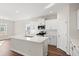 Modern kitchen with white cabinets, quartz countertops and island at 315 Hayloft Circle, Conway, SC 29526