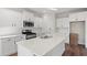 Modern kitchen with white cabinets, quartz countertops, and stainless steel appliances at 315 Hayloft Circle, Conway, SC 29526