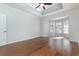 Bedroom with hardwood floors, ceiling fan, and large windows at 323 Trestle Way, Conway, SC 29526