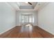 A light filled bedroom with beautiful wood floors and an attractive bay window at 323 Trestle Way, Conway, SC 29526