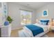Comfortable bedroom decorated in blue with a bright window view to the backyard at 323 Trestle Way, Conway, SC 29526