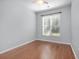 Bright bedroom with hardwood flooring and a large window at 323 Trestle Way, Conway, SC 29526