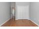 Neutral-toned bedroom with hardwood floors and a large closet at 323 Trestle Way, Conway, SC 29526
