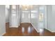 An inviting foyer with gleaming hardwood floors and classic architectural columns at 323 Trestle Way, Conway, SC 29526