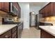 Spacious kitchen features stainless appliances, beautiful cabinetry and tile backsplash at 323 Trestle Way, Conway, SC 29526