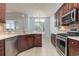 Open kitchen featuring stainless appliances, granite counters, and tile flooring at 323 Trestle Way, Conway, SC 29526