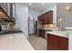 Well-equipped kitchen boasts stainless steel appliances, ample cabinet space, and tiled flooring at 323 Trestle Way, Conway, SC 29526