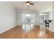 Open concept living area with hardwood floors adjacent to kitchen and dining nook at 323 Trestle Way, Conway, SC 29526