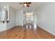 Open living room with hardwood floors, a ceiling fan, an open-concept layout and light-colored walls at 323 Trestle Way, Conway, SC 29526