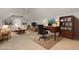 Bright, open living space features neutral decor, comfortable seating, and a functional desk area at 323 Trestle Way, Conway, SC 29526