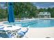 Community swimming pool surrounded by lounge chairs at 323 Trestle Way, Conway, SC 29526