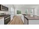 Modern kitchen featuring granite countertops, stainless steel appliances, and a stylish island with a sink at 389 Sun Colony Blvd., Longs, SC 29568