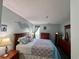 Comfortable bedroom with a cozy bed, wooden furnishings, and decor at 1101 Possum Trot Rd. # B302, North Myrtle Beach, SC 29582