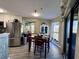 Cozy dining area featuring a wooden table set and a window that lets in natural light at 1101 Possum Trot Rd. # B302, North Myrtle Beach, SC 29582