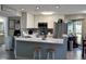 Well-lit kitchen features a breakfast bar, stainless appliances, and plenty of storage at 1101 Possum Trot Rd. # B302, North Myrtle Beach, SC 29582