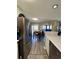 Open kitchen features stainless steel appliances and a dining area with an outdoor view at 1101 Possum Trot Rd. # B302, North Myrtle Beach, SC 29582