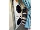 Convenient laundry area with modern, stacked washer and dryer for efficient space saving at 1101 Possum Trot Rd. # B302, North Myrtle Beach, SC 29582