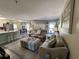 Comfortable living room with plush seating, stylish decor, and a view of the dining area at 1101 Possum Trot Rd. # B302, North Myrtle Beach, SC 29582