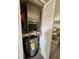 Utility closet with HVAC unit and hot water heater, efficiently housed within the home at 1101 Possum Trot Rd. # B302, North Myrtle Beach, SC 29582