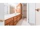 Bathroom featuring wood vanity, tiled floors, and toilet at 244 George Washington Trail, Georgetown, SC 29440