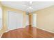 Bedroom featuring hardwood floors, a ceiling fan, and closet space at 244 George Washington Trail, Georgetown, SC 29440