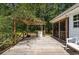 Wooden deck with pergola and wooded views at 244 George Washington Trail, Georgetown, SC 29440