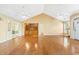 Open floor plan with hardwood floors, built-in cabinets, high ceilings, and natural light at 244 George Washington Trail, Georgetown, SC 29440