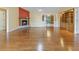 Living room featuring hardwood floors, high ceilings, and fireplace with built-in wooden storage at 244 George Washington Trail, Georgetown, SC 29440