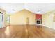 Living room featuring hardwood floors, fireplace, and high ceilings with two ceiling fans at 244 George Washington Trail, Georgetown, SC 29440