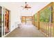 Covered porch with wood beams overlooking wooded area at 244 George Washington Trail, Georgetown, SC 29440