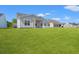 Manicured backyard featuring a lawn and covered porch area at 3344 Little Bay Dr., Conway, SC 29526