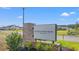 Welcoming entrance sign for Rivertown Row North, nestled amongst lush greenery and modern homes at 3344 Little Bay Dr., Conway, SC 29526