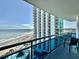 Condo balcony with seating overlooking the ocean and resort at 107 S Ocean Blvd. # 808, Myrtle Beach, SC 29577