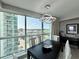 Bright dining room with a contemporary lighting fixture and expansive city views at 107 S Ocean Blvd. # 808, Myrtle Beach, SC 29577
