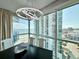 Bright dining room with ocean view, contemporary lighting, and modern black table at 107 S Ocean Blvd. # 808, Myrtle Beach, SC 29577