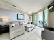 Inviting living room with stylish seating, ocean view balcony access, and bright, airy space at 107 S Ocean Blvd. # 808, Myrtle Beach, SC 29577