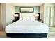 King bed with accent wall and stylish bedside lamps at 107 S Ocean Blvd. # 808, Myrtle Beach, SC 29577