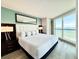 Bright main bedroom featuring a king bed, stylish lamps, and ocean views at 107 S Ocean Blvd. # 808, Myrtle Beach, SC 29577