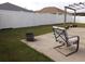 Well-kept backyard with white fence, seating, and potted plants at 237 Cloverleaf Dr., Longs, SC 29568