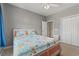 Comfortable bedroom featuring a bed with white frame and colorful ocean-themed bedding at 237 Cloverleaf Dr., Longs, SC 29568