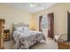 Cozy bedroom with Paris-themed bedding, bedside tables, and a ceiling fan at 237 Cloverleaf Dr., Longs, SC 29568