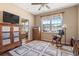 Cozy bonus room with natural light from a large window, rocking chair, and stylish furnishings at 237 Cloverleaf Dr., Longs, SC 29568