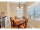 Bright breakfast nook features a wooden table, seating for four, and natural light from a nearby window at 237 Cloverleaf Dr., Longs, SC 29568