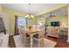 Bright dining room with wood floors, a chandelier and easy access to other rooms at 237 Cloverleaf Dr., Longs, SC 29568